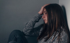 Sad girl sitting on the floor in corner of room,  portrait of a sad teenage girl looking thoughtful about troubles. Depressed teenage girl. Lonely Depressed Teen Girl. Unhappy depressed teenager