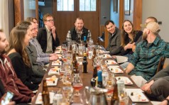 Optimized-Canva - Group of People Sitting on Dining Table