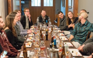 Optimized-Canva - Group of People Sitting on Dining Table