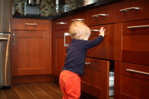 Toddler opening kitchen drawers